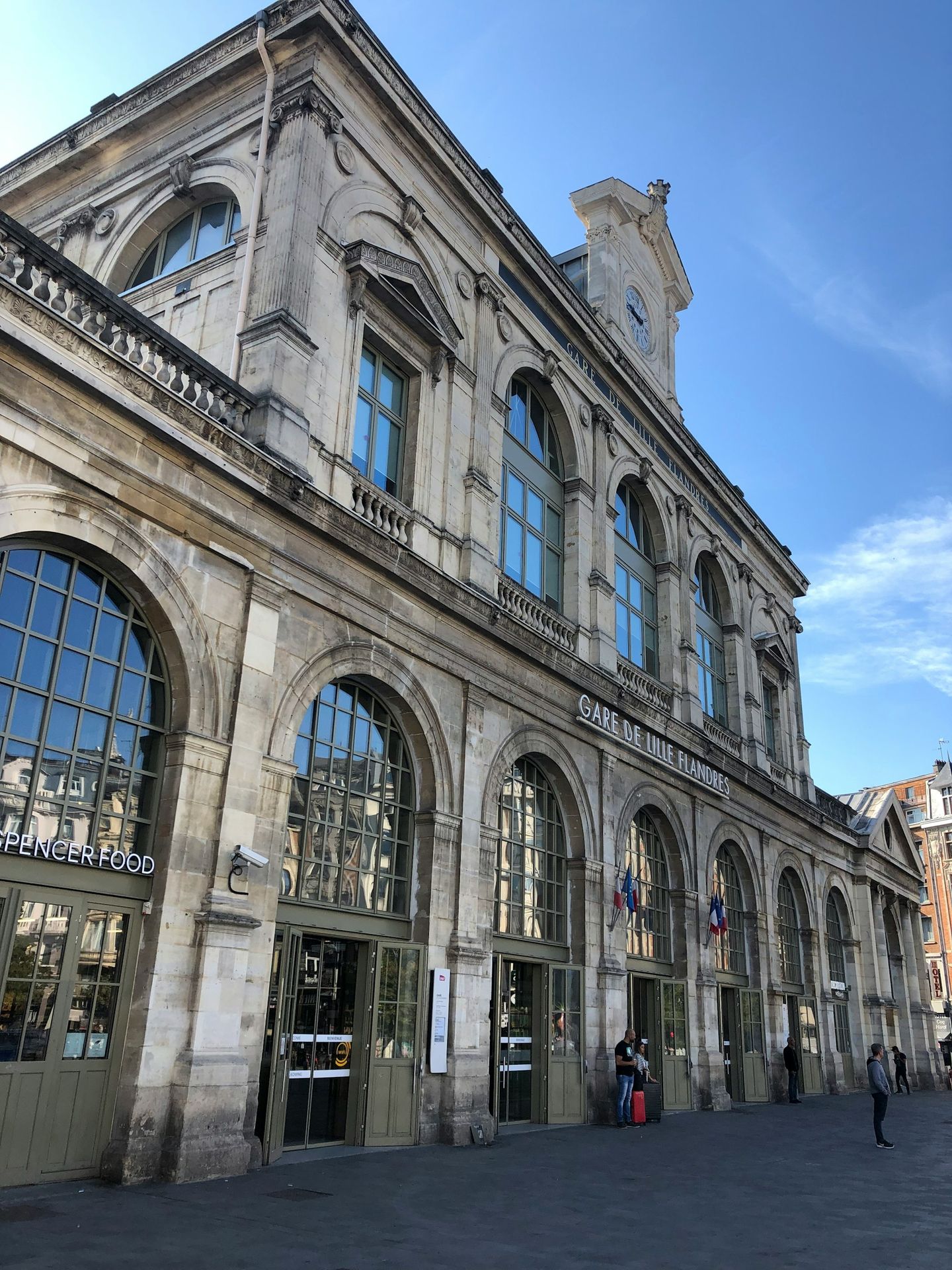 people walking on street near building during daytime
